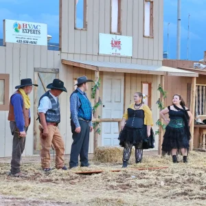 Wild West-themed outdoor performance with actors.
