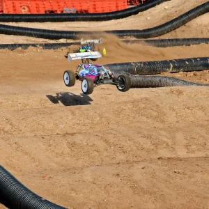 Colorful buggy spraying dirt behind